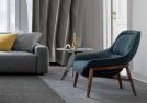 Poltroncina moderna in tessuto con schienale avvolgente Hanna outlet - BertO Shop