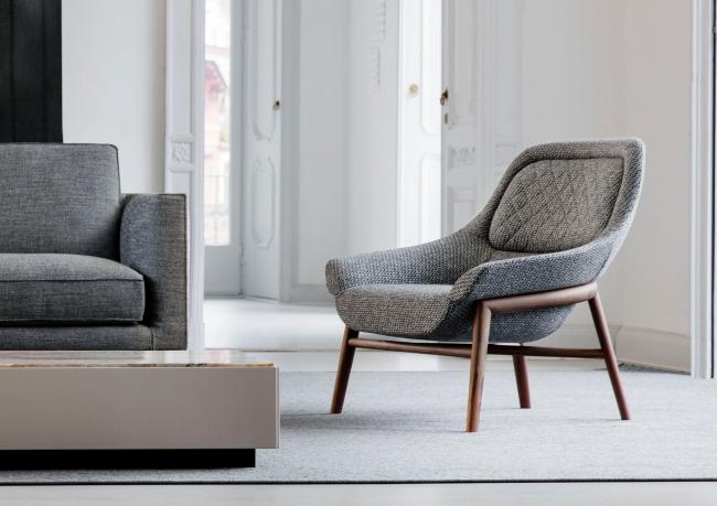Poltroncina moderna in tessuto con schienale avvolgente Hanna outlet - BertO Shop