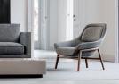 Poltroncina moderna in tessuto con schienale avvolgente Hanna outlet - BertO Shop